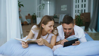 Couple reading together in bed
