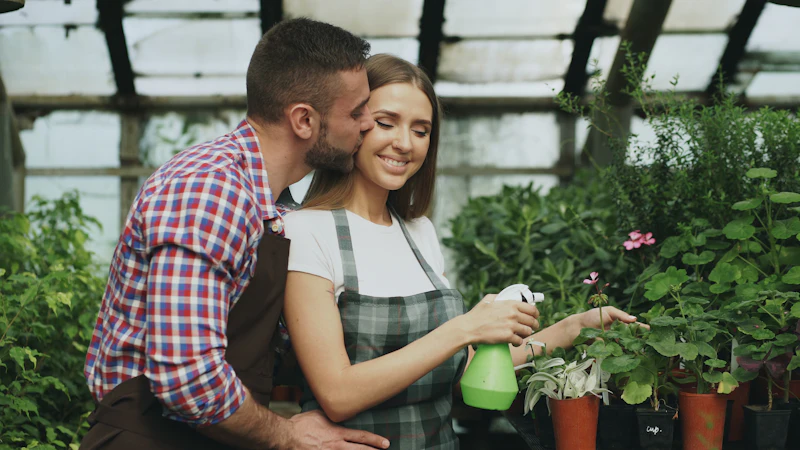 Household couple tending plants together