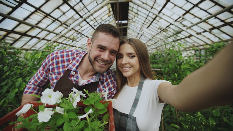 Couple’s joyful selfie in greenhouse