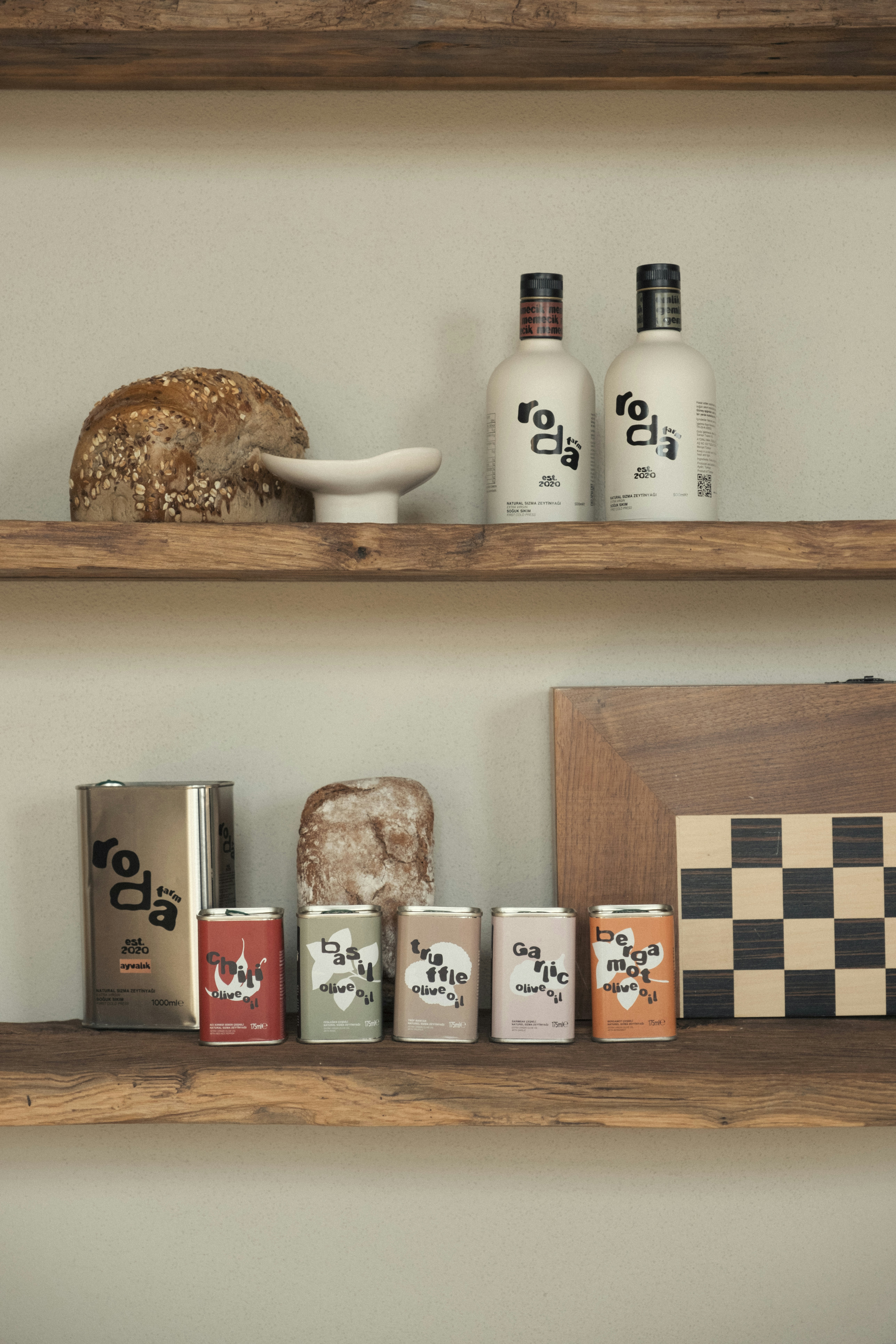 Bottles, cans, bread, and chessboard on shelves