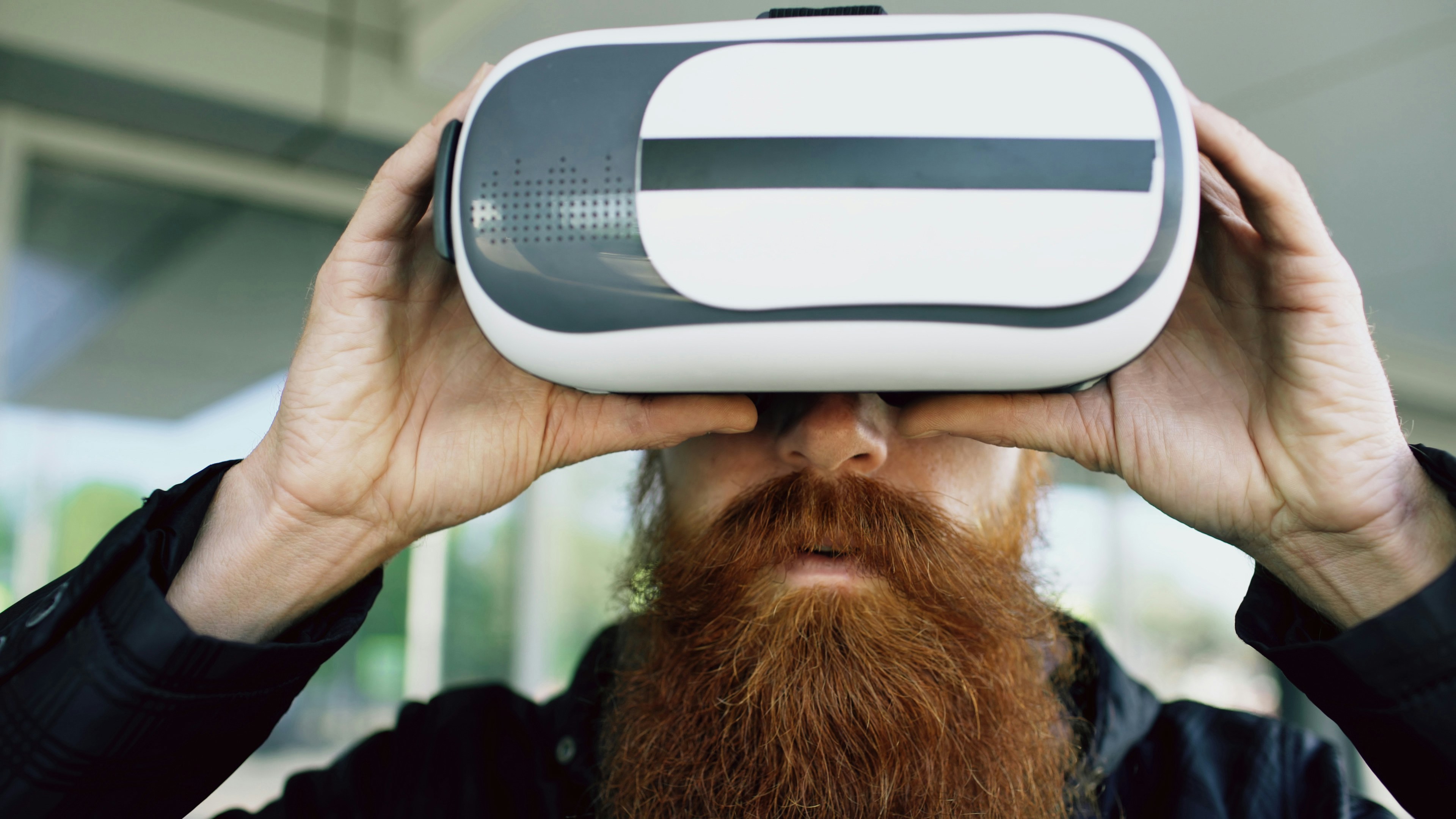 Closeup of a man using VR headset