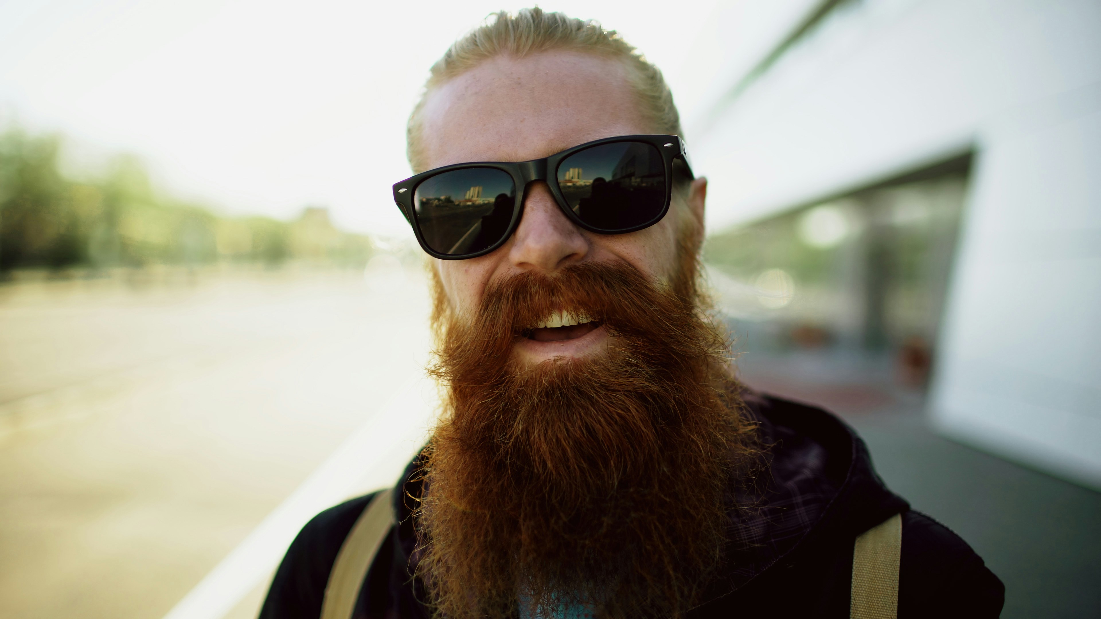 Young bearded hipster man exploring city streets