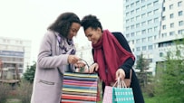 Two women looking into shopping bags