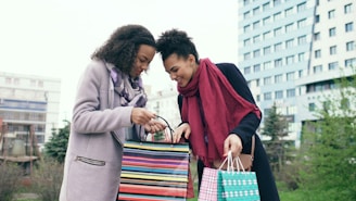 Two women looking into shopping bags