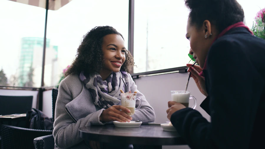 Two students talking over coffee, a mentoring conversation