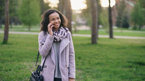 Woman talking on phone in a park