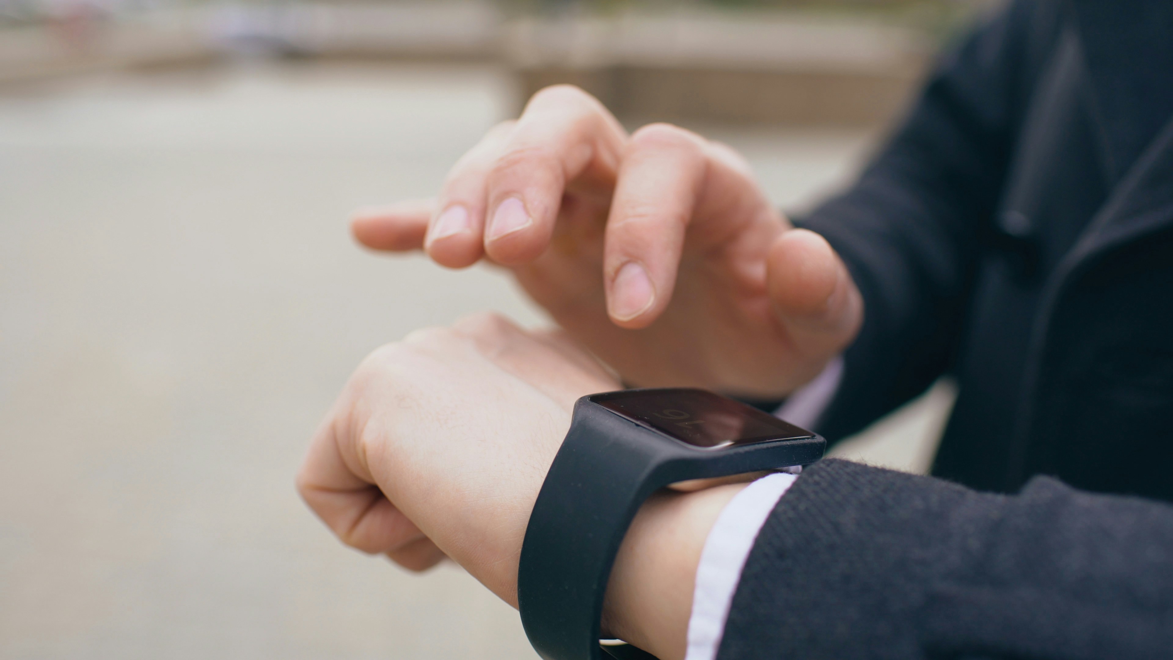 Person wearing and using a smartwatch