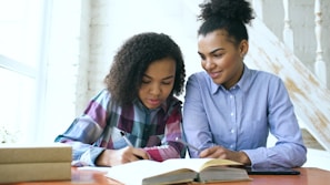 Two women studying together at a table.
