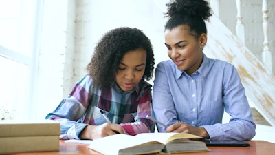 Two women studying together at a table.
