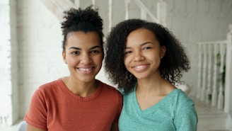 Two young women smiling at the camera