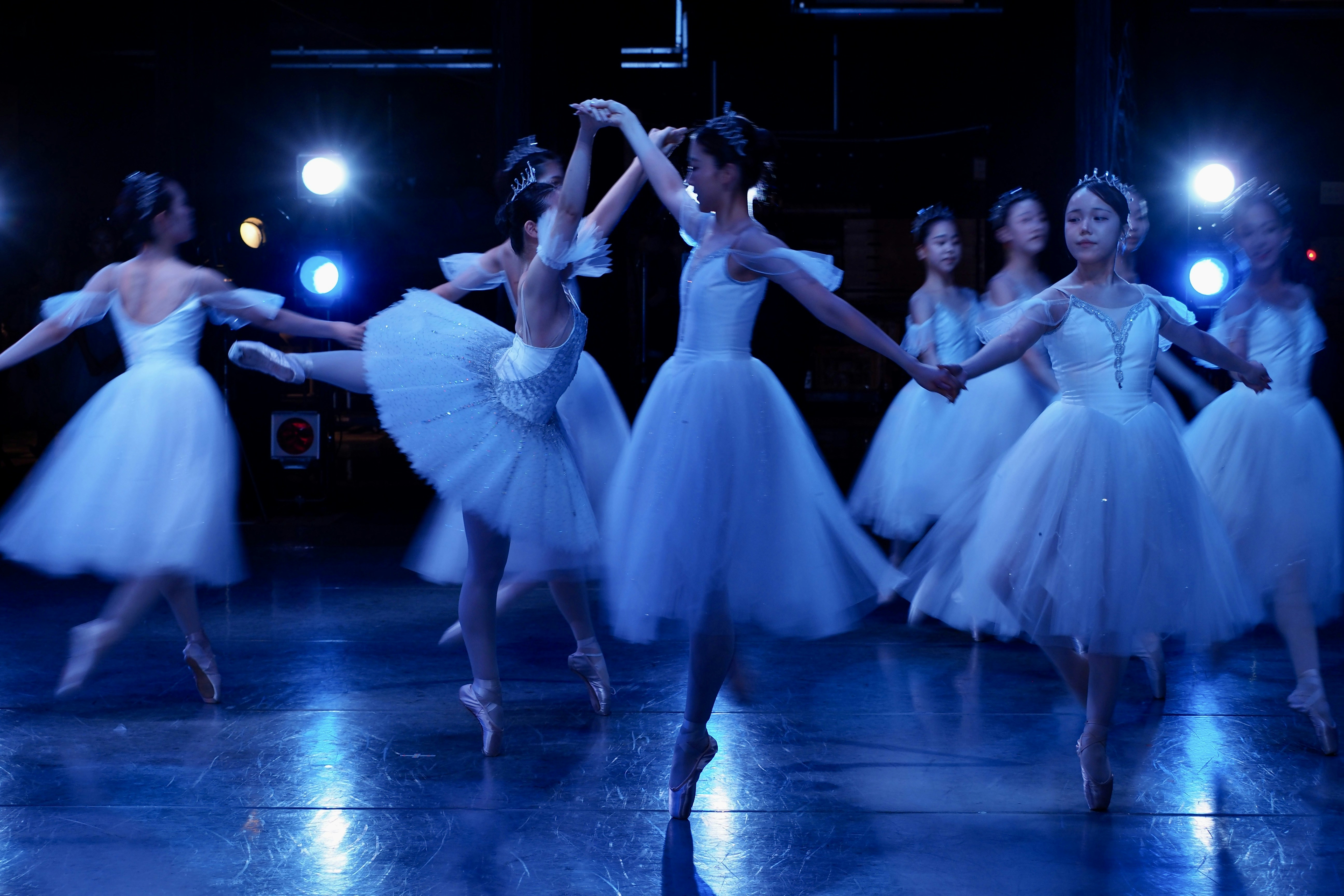Ballet dancers in white tutus performing