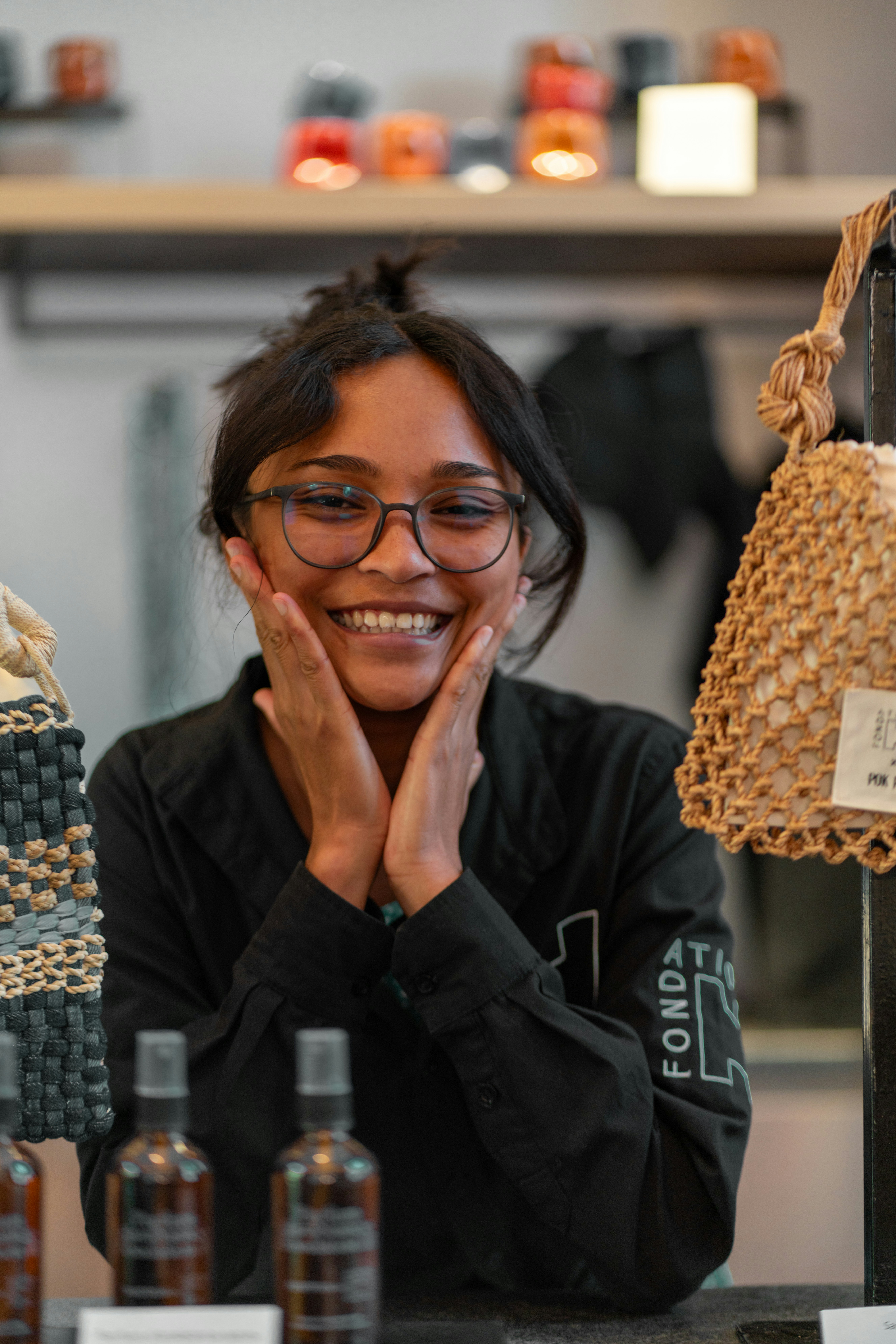 Smiling woman with hands on her cheeks