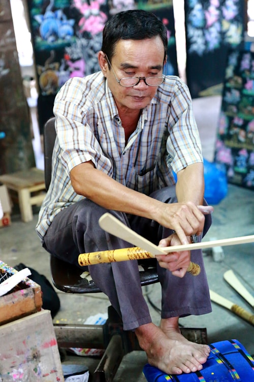 Filipino craftsman with woodworking tools