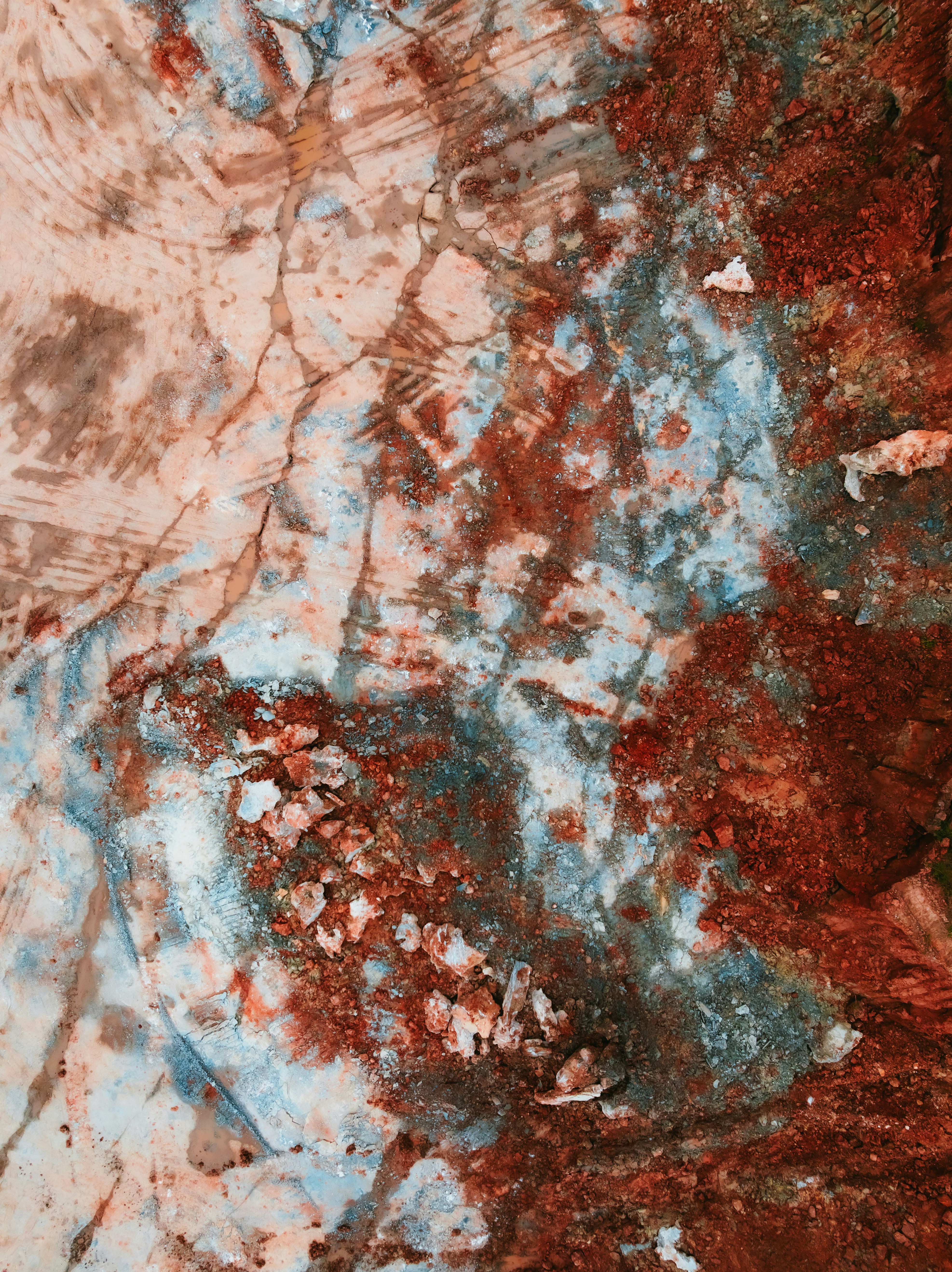 Abstract texture with earthy red and blue tones