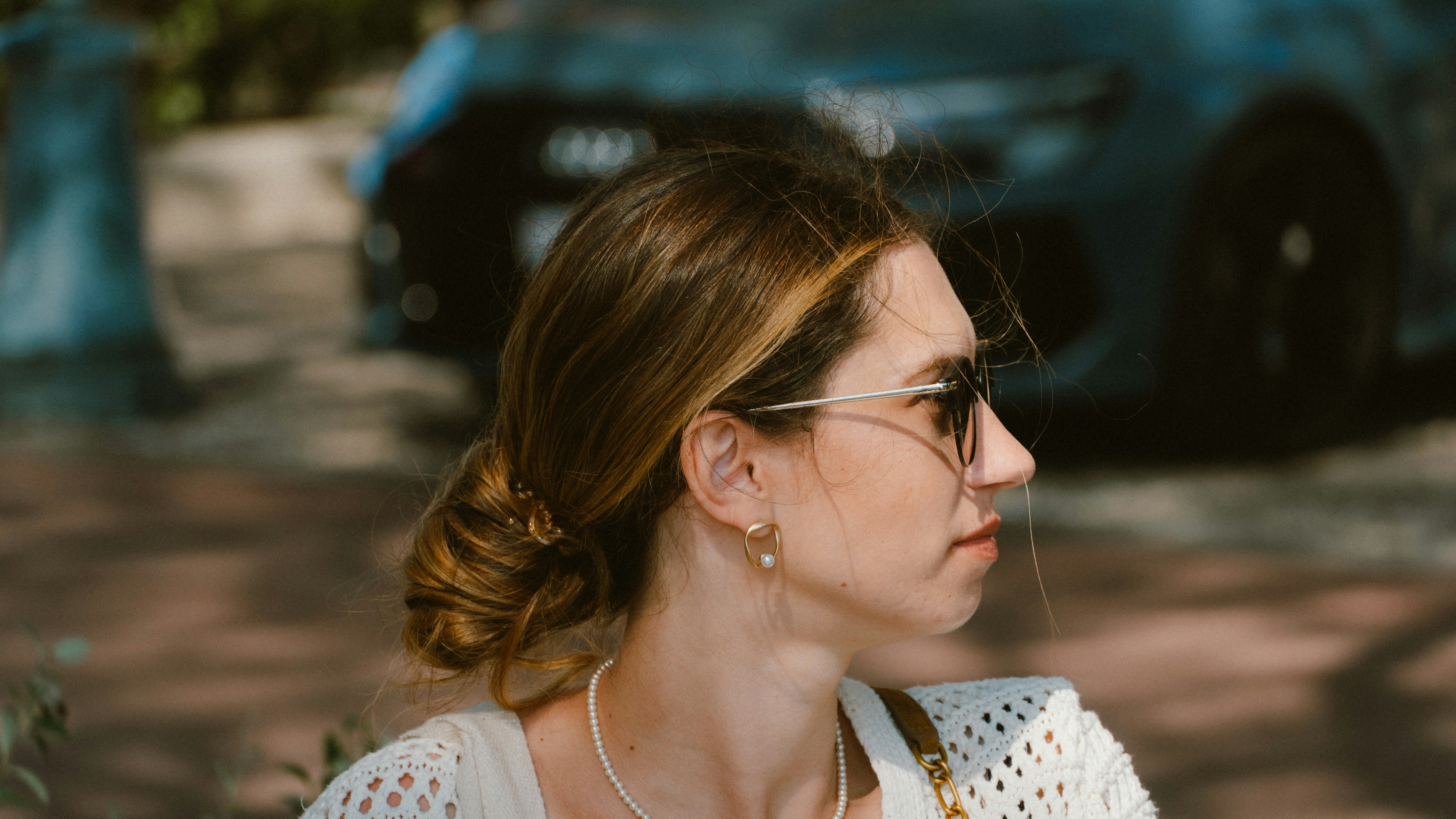 Woman with sunglasses looking away from camera