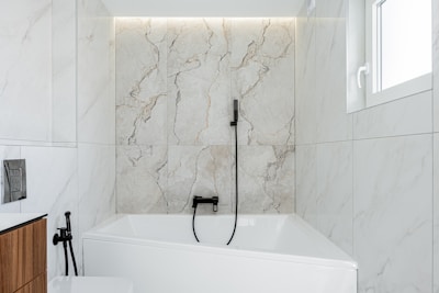 Elegant marble bathroom renovation with modern oval sink