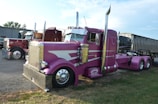 A custom pink semi-truck with chrome accents.