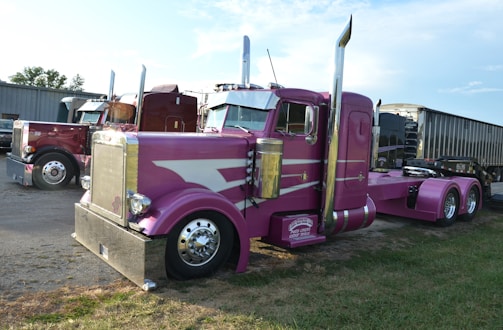 A custom pink semi-truck with chrome accents.