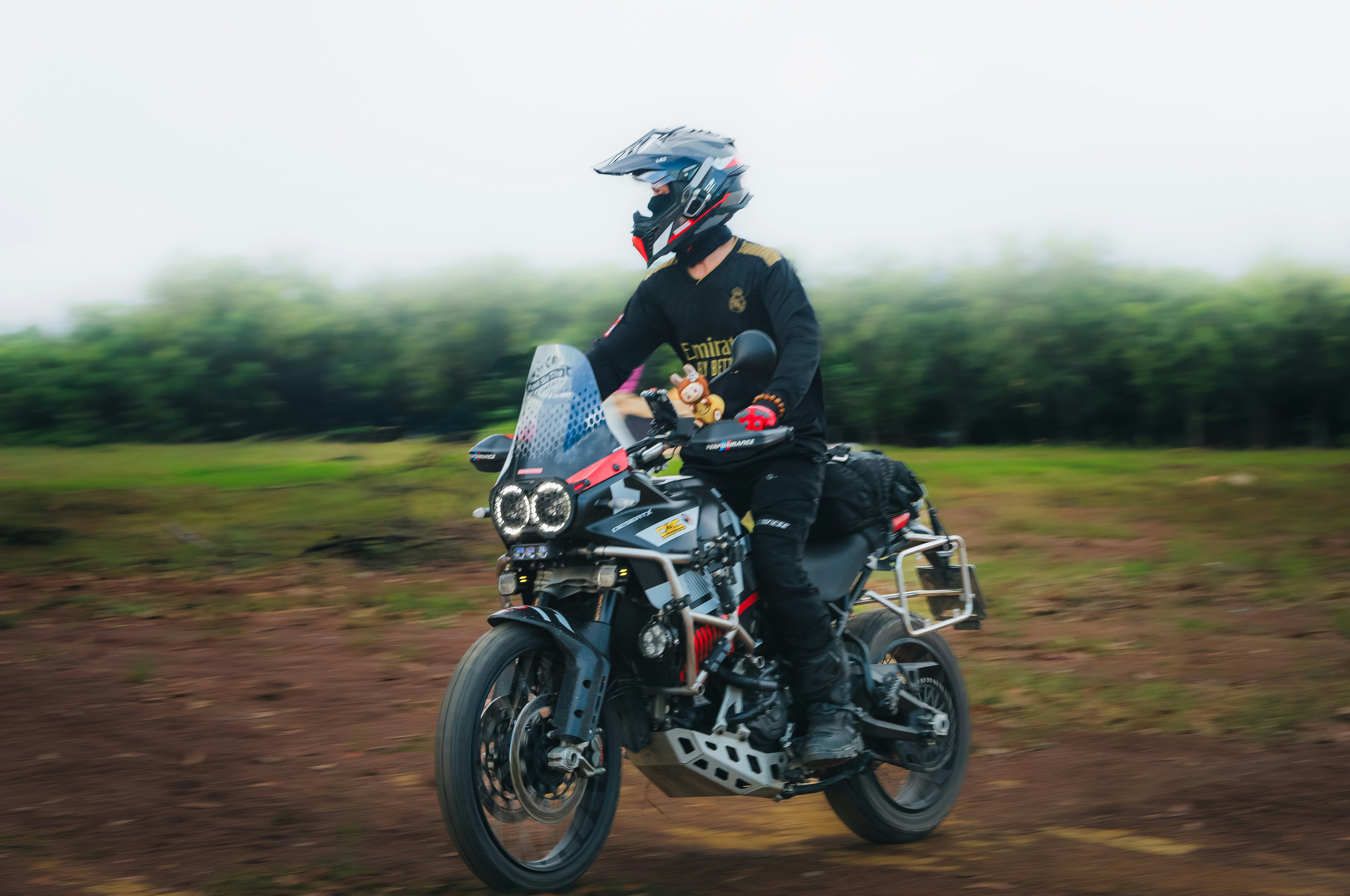 Rider on a motorcycle on a dirt road