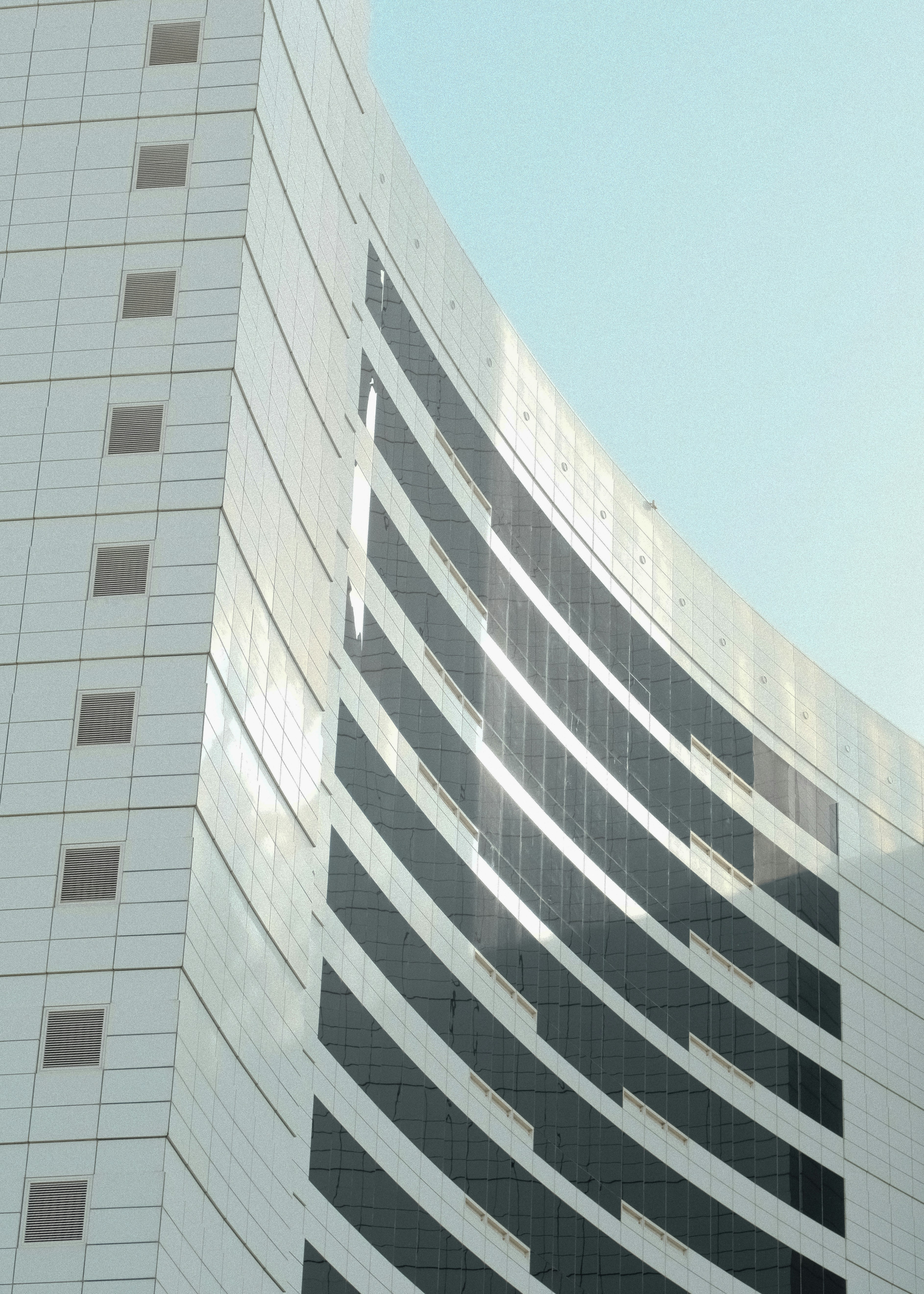 Modern building facade with curved glass windows