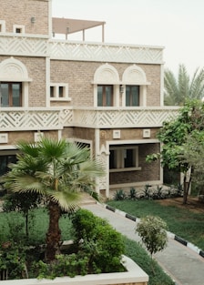 Traditional building with ornate details and lush greenery