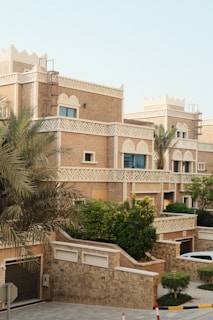 Traditional desert-style townhouses with intricate details.
