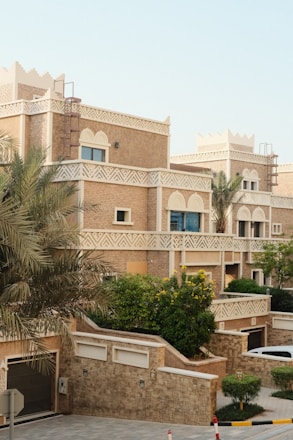 Traditional desert-style townhouses with intricate details.
