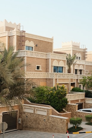 Traditional desert-style townhouses with intricate details.
