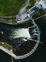 Aerial view of a dam with water flowing over it.