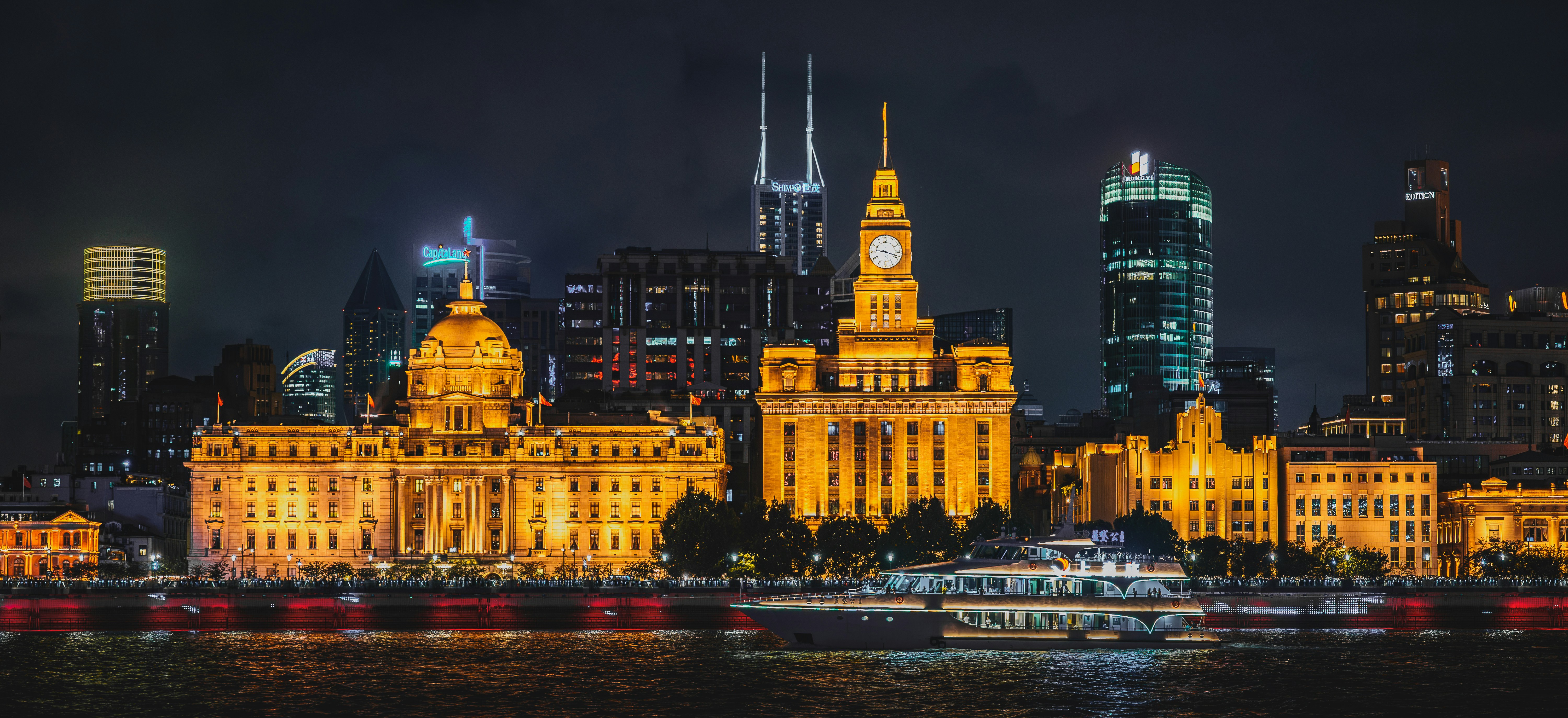 City skyline with illuminated buildings at night.