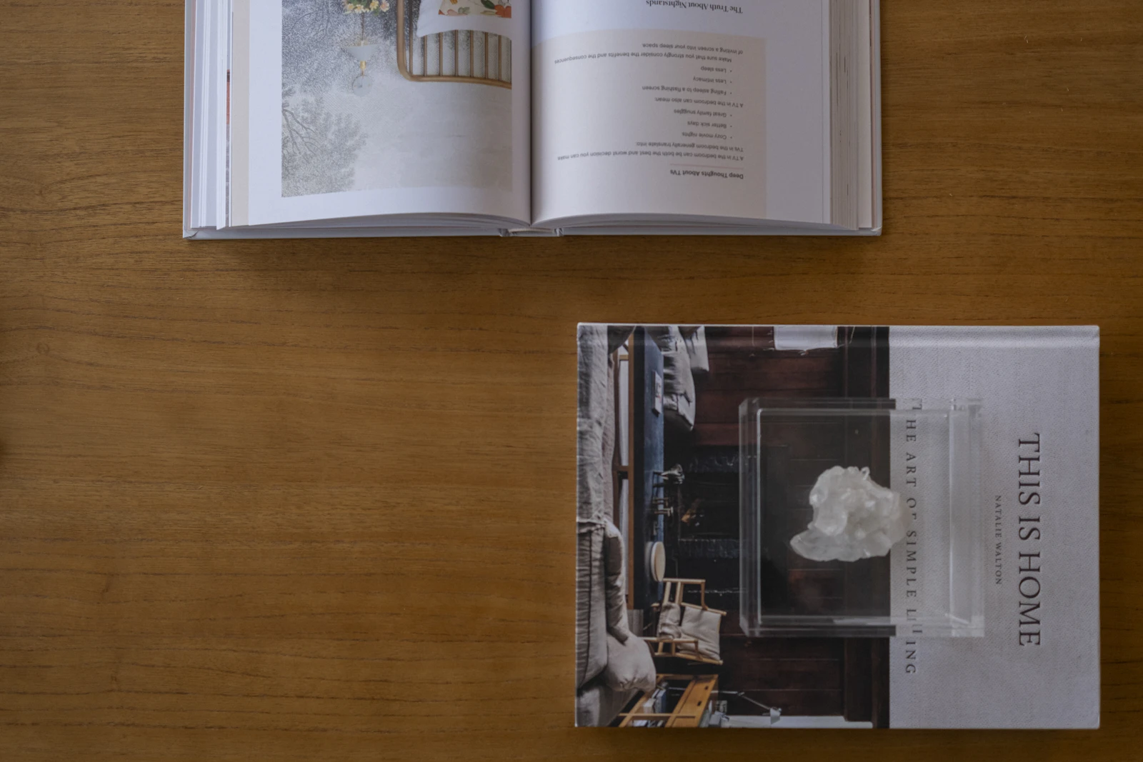 An open book and a clothbound volume laid out on a wooden table, the paper trail behind a federal review.