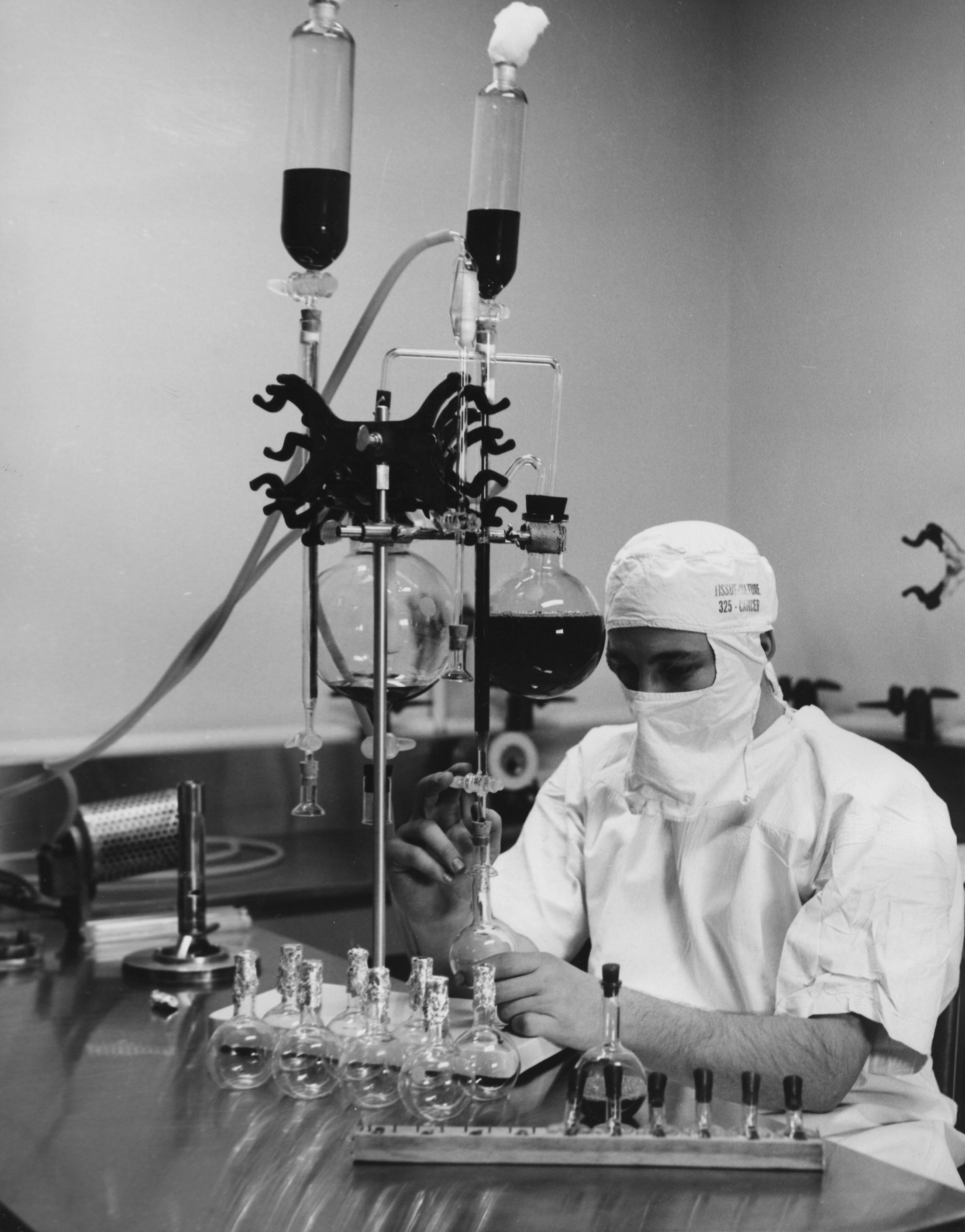 Scientist working with medical equipment in laboratory