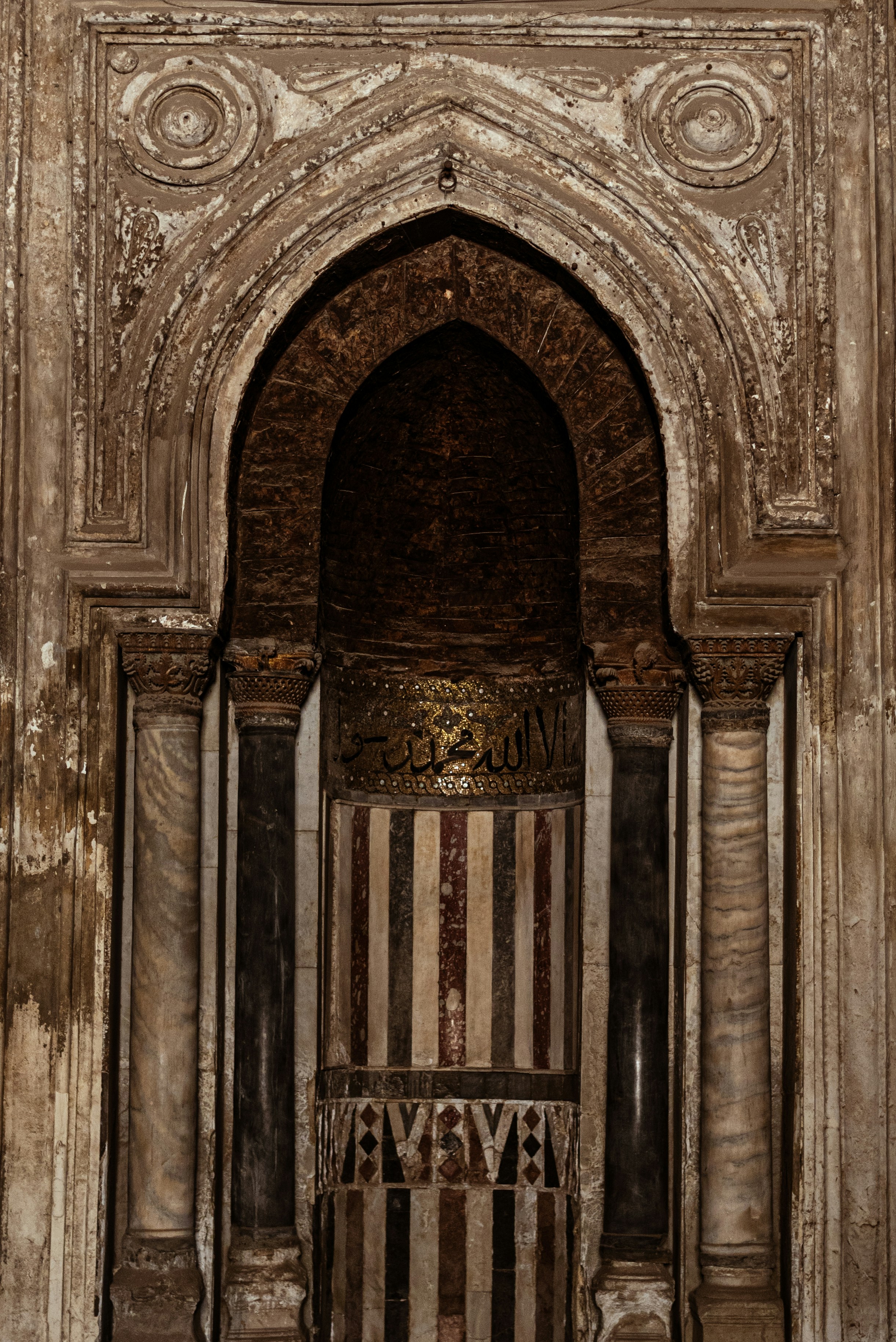 Intricate islamic architectural detail with marble columns.