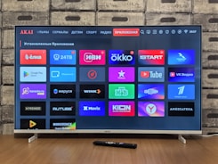 Smart TV screen displaying various application icons.