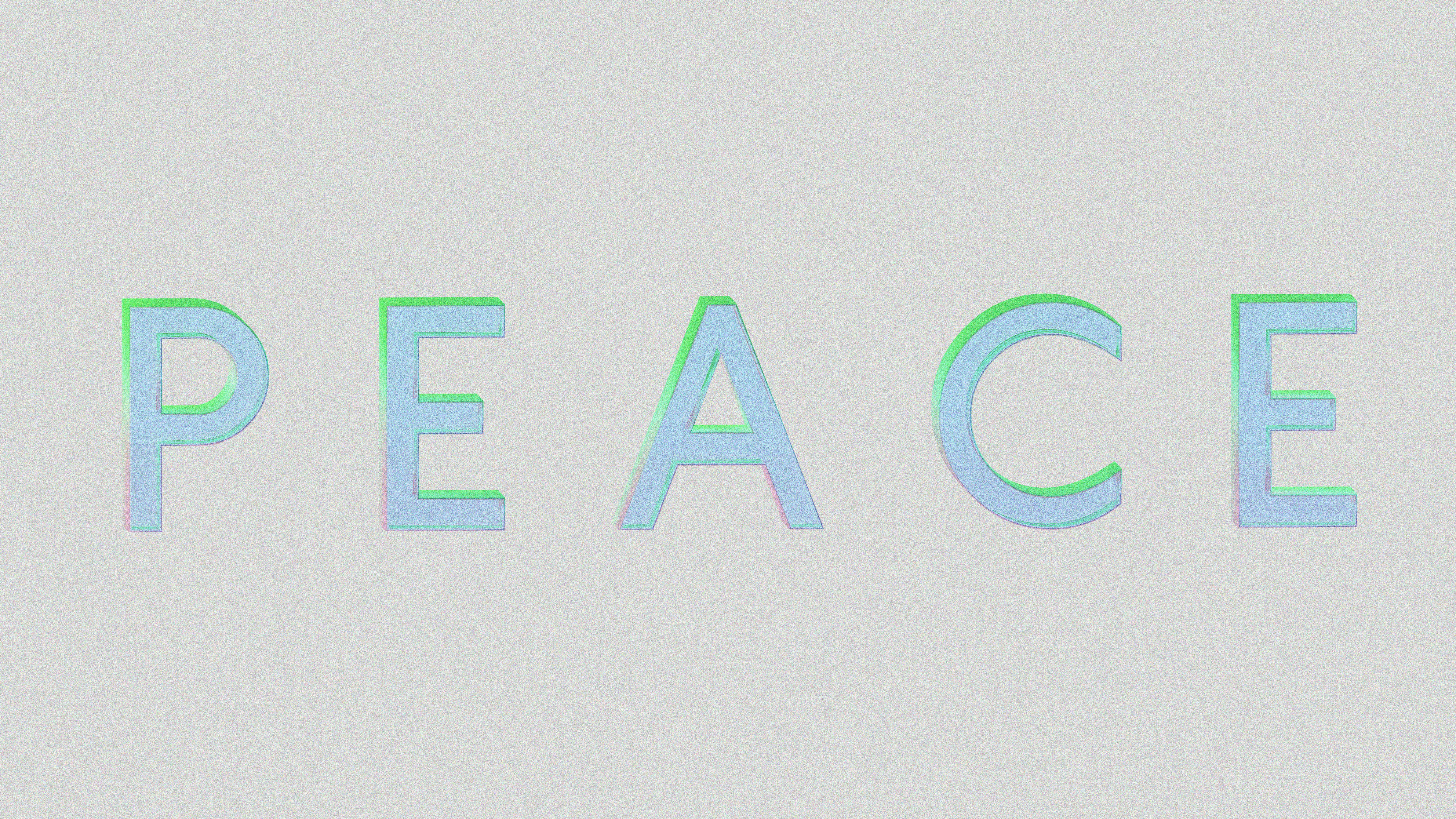 The word peace in light blue and green letters.