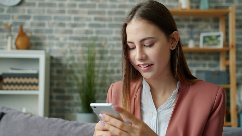 Person comfortably texting on couch