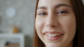 Young woman smiling with light makeup