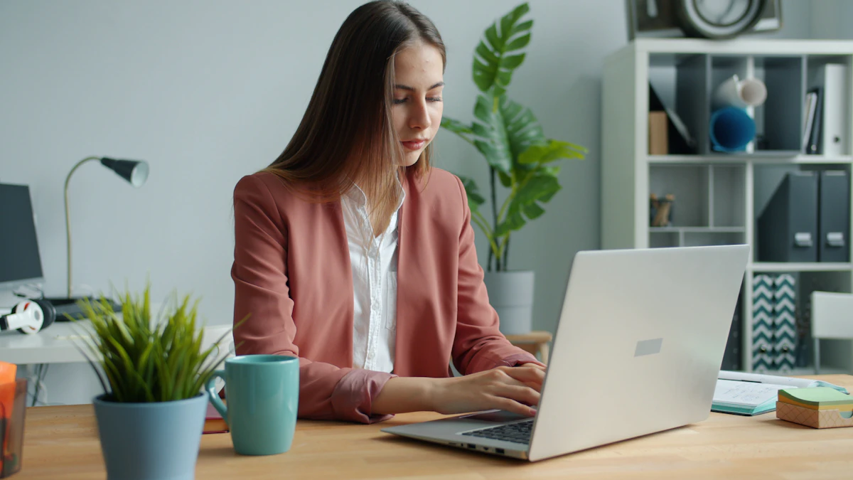 Business professional working on a laptop in a modern office