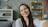 Young woman smiling and taking a selfie indoors