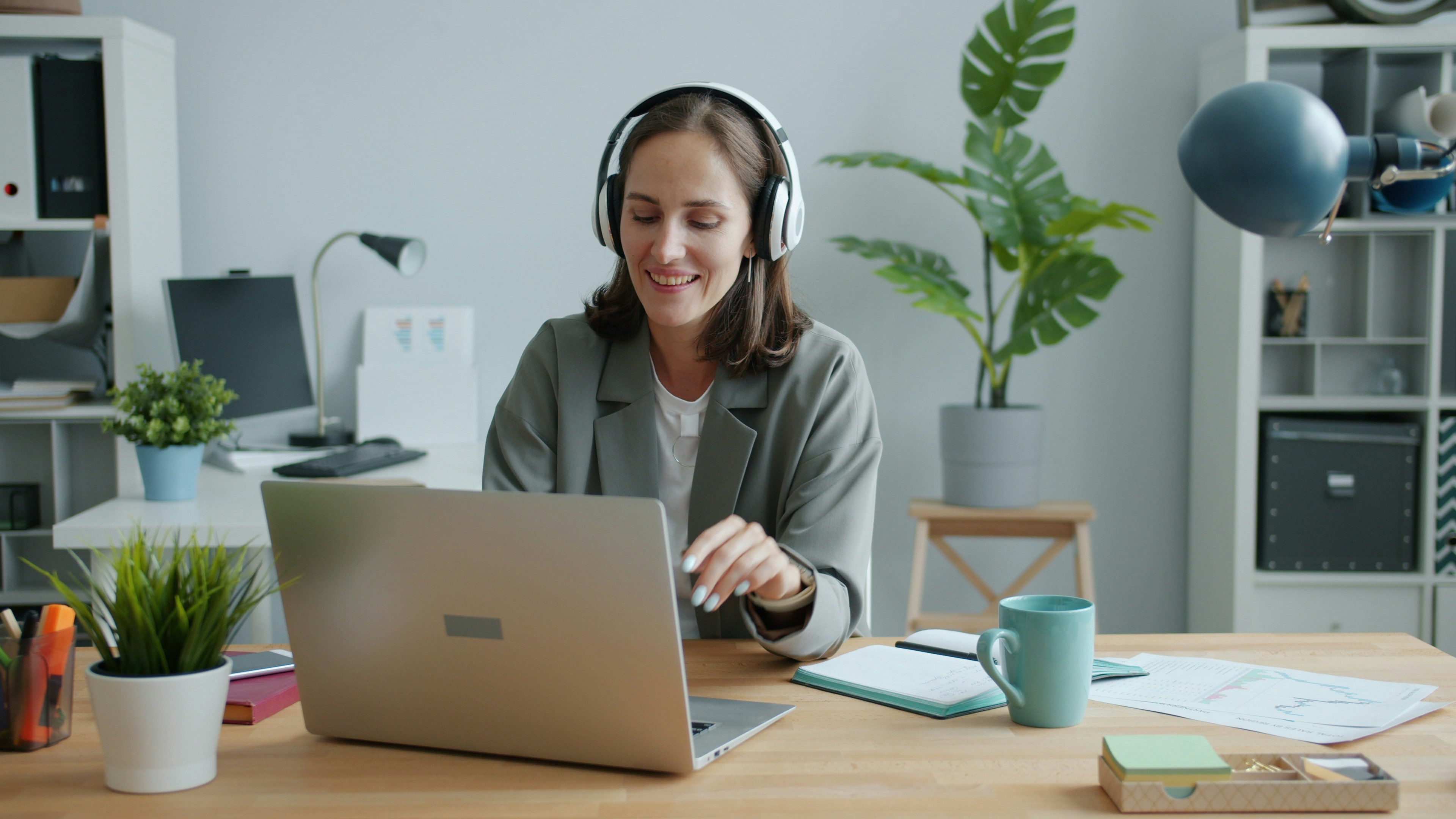 Happy office worker with laptop