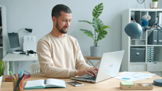 Man working on laptop at a desk