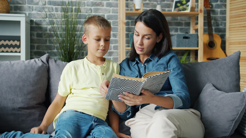 A parent and child reading a book together