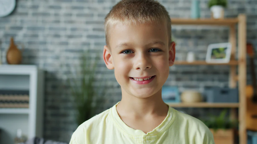 Smiling young boy sitting in a chair