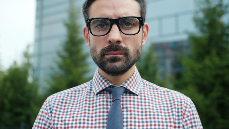 confident man with glasses and tie