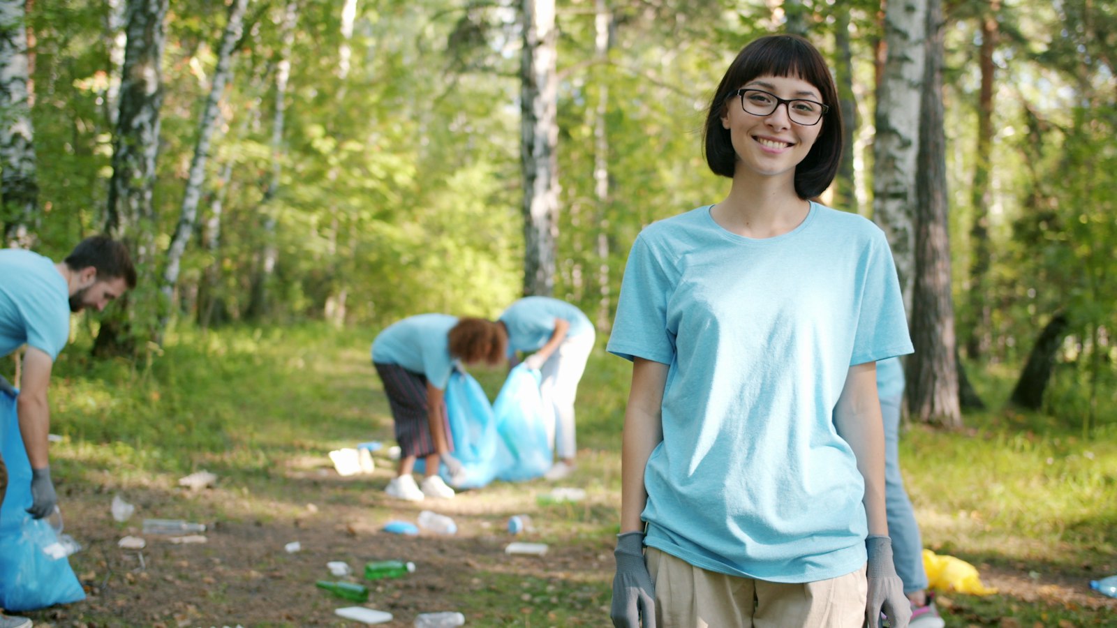 Gap year volunteers working together on a community cleanup project