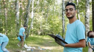 Man with clipboard in a park cleanup