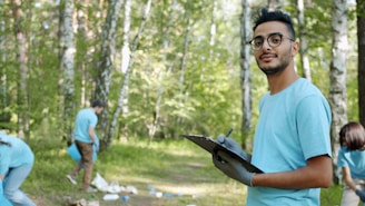 Man with clipboard in a park cleanup