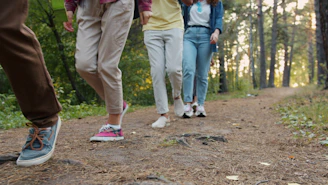 Group of people walking on a forest path