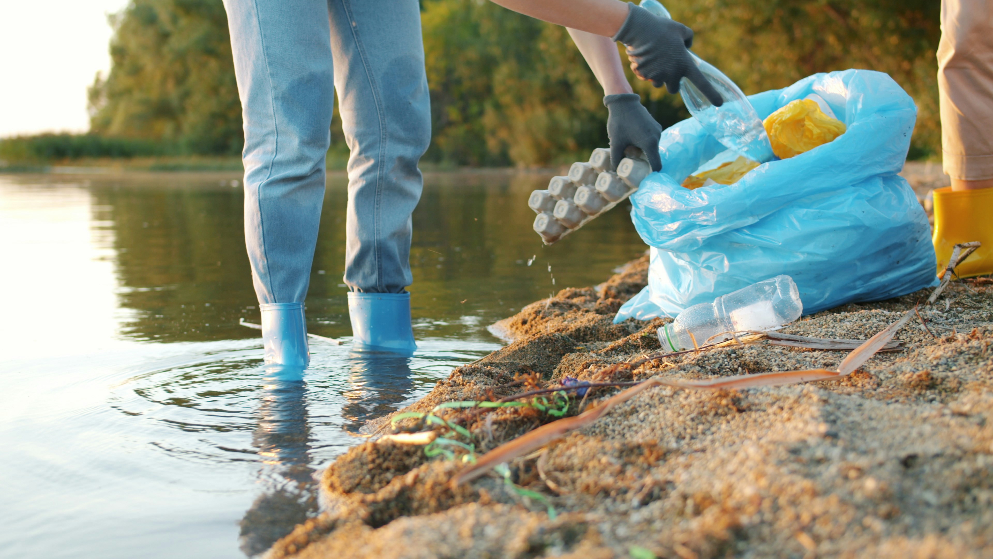 Women volunteers cleaning river