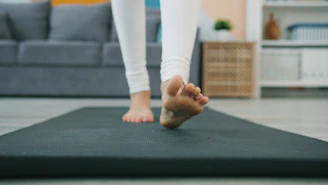 Bare feet walking on a yoga mat
